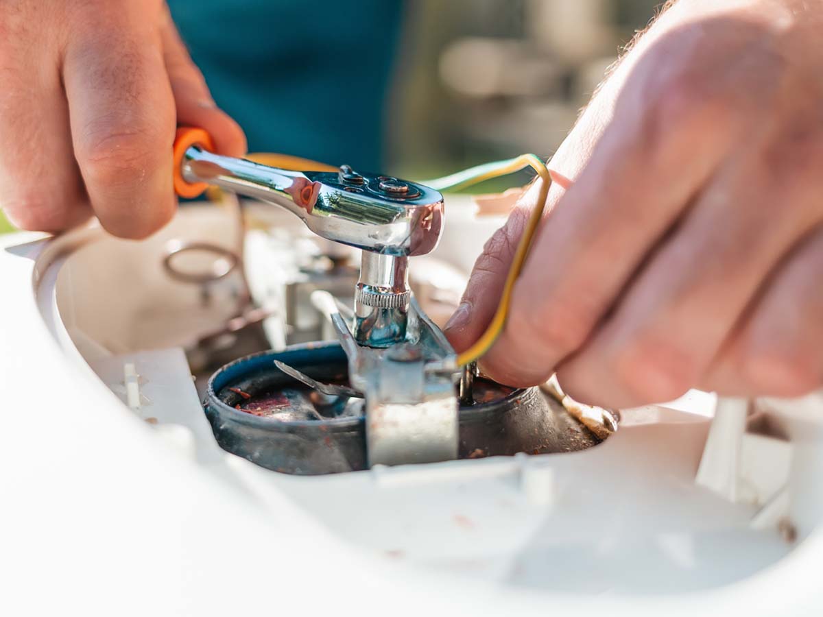 a man repairing a water heater